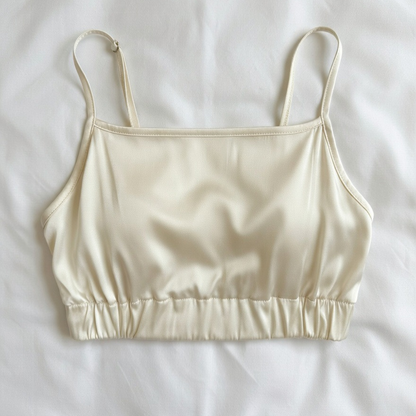 yellow satin crop top on a white background