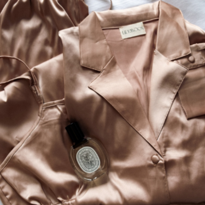 Champagne satin pyjamas set with a brand label on a light background