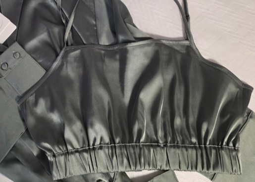 Green Satin bralette on a light background